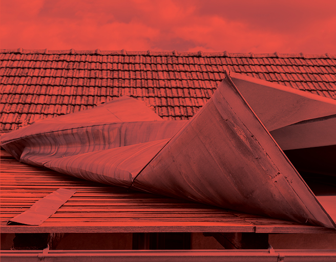 Roof curling off a building