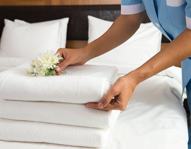 folded towels on a bed